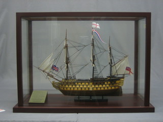 A wooden model of HMS Victory, cased, 35"