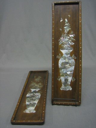 A pair of Eastern rectangular hardwood panels with inlaid mother of pearl decoration depicting an urn of flowers  24" x 7"
