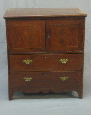 A Georgian style mahogany commode fitted a cupboard above 2 short drawers, raised on bracket feet 25"