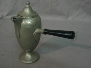 An Art Nouveau planished round head pewter side handled coffee pot with detachable ebony handle 9"