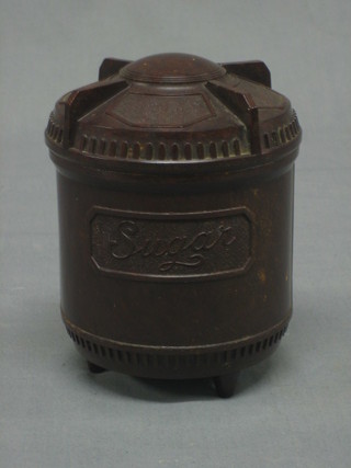 A brown Bakelite cylindrical sugar box and cover 5"