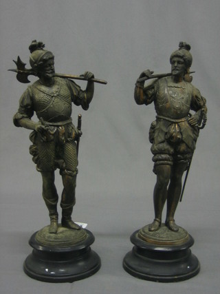 A pair of spelter figures of warriors raised on socle bases 14"