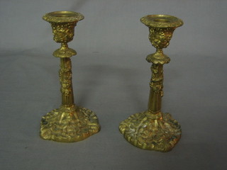 A pair of 19th/20th Century gilt ormolu candlesticks with vinery decoration 7 1/2"