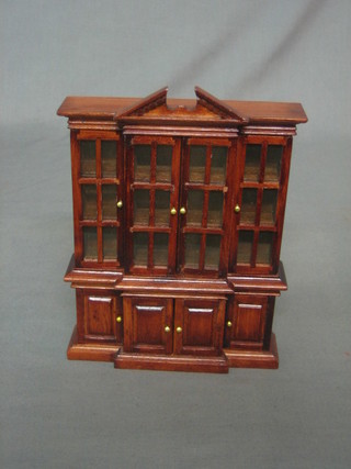 A dolls house Georgian style mahogany break front bookcase 5"