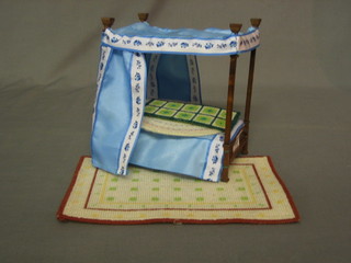 A dolls house 4 poster bed 7" and 2 dolls house rugs