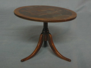 A circular walnut and crossbanded Victorian apprentice style pedestal breakfast table, raised on pillar and tripod supports 6"