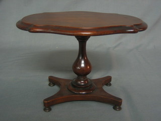 A William IV style oval mahogany apprentice snap top breakfast table raised on pillar and tripod supports with triform base 11"