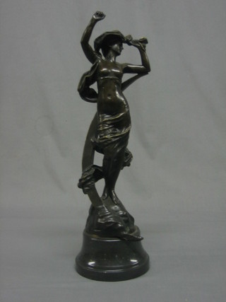 A reproduction Art Nouveau style bronze figure of a standing semi-clad lady with ribbon 20", raised on a socle base