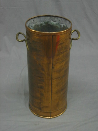 A circular twin handled stick or umbrella stand made from a fire extinguisher