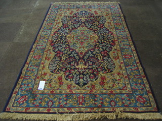 A contemporary Kyamon rug with central medallion within multi row borders 83"x49"