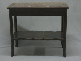 A Victorian rectangular carved oak 2 tier occasional table, heavily carved throughout, raised on square supports 30"