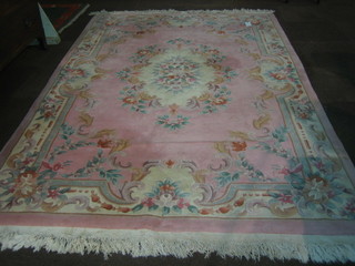 A Chinese pink and floral patterned carpet 116"x72"