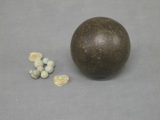 A cast iron cannon ball 2" and various musket balls etc