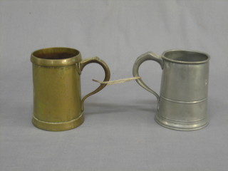 A Victorian pewter quart tankard marked Tweed Epping and a Victorian brass quart measure (2)
