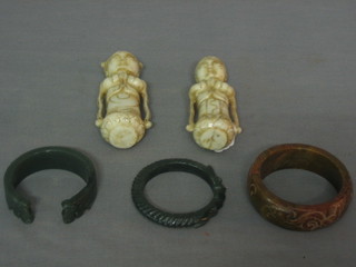 A pair of Eastern carved hardwood figures of Deities 4 1/2" and 3 Eastern hardstone bangles