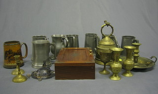 A circular brass chamber stick and snuffer, a brass model of a dog, various Eastern brasses and pewter tankards etc