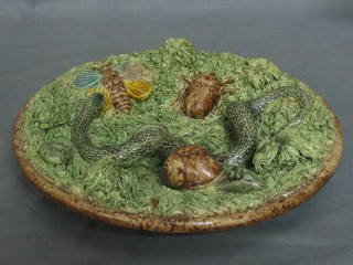 A circular Portuguese Majolica plate decorated snake and snail, the reverse with impressed crown and marked Babax Portugal (f and r) 8"