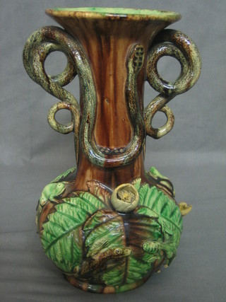A Portuguese Majolica club shaped vase, the handle in the form of 2 serpents and decorated various lizards (f), the base with impressed mark 10"