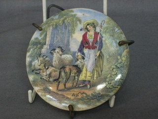 A 19th Century Prattware pot lid decorated a Shepherdess 4" contained in a metal frame