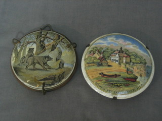A 19th Century Prattware pot lid - Pegwell Bay established 1760 (cracked) and 1 other decorated walking wolves 3 1/2" (f and r) contained in a metal frame