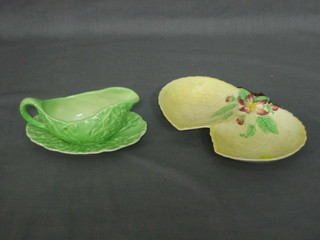 A Carltonware green leaf shaped sauce boat and stand 5" and a yellow Carltonware twin section dish 7"