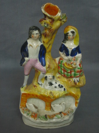 A 19th Century Staffordshire flat back figure group in the form of Lady and Gentleman by arbour with dog 8" (f)