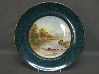 A circular Royal Doulton plate decorated a landscape signed C Hart, with malachite coloured banding, the reverse marked Royal Doulton BB1129 H1635 10"