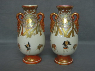 A pair of 19th Century Oriental porcelain twin handled vases, the base with 4 character mark 9"
