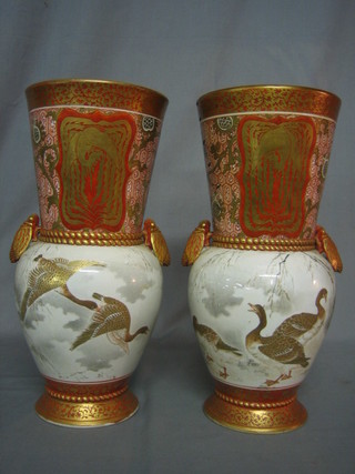 A handsome pair of 19th Century Oriental vases of waisted form with scarab handles, the bodies decorated beasts and with gilt and red decoration throughout, 17" (1 heavily f and r)