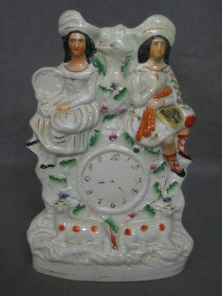 A 19th Century Staffordshire flat back figure group in the form of a clock 10" (f and r)