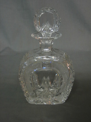 A cut glass arch shaped decanter and stopper 7"