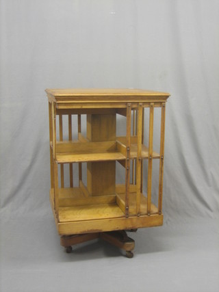 A square honey oak revolving bookcase 23"
