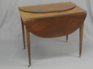 A Georgian mahogany oval Pembroke table, fitted a frieze drawer and raised on square tapering supports, ending in brass caps and castors (1 flap f)