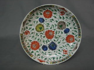 A circular famille vert Oriental dish with floral decoration 10" (heavily restored)