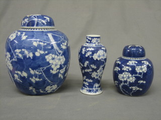 An Oriental prunus pattern ginger jar and cover (lid f) 8", 1 other Oriental ginger jar, 2 Oriental blue and white urns and covers the bases with 4 character mark 7" (f), a pair of club shaped urns and vases with prunus decoration 7" (no lids), an Oriental blue and white vase 8" with 4 character mark to base, an Oriental blue and white bowl 9"