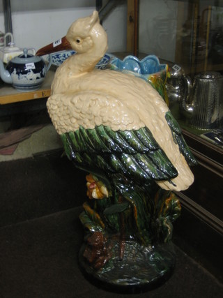 A large Victorian style pottery planter in the form of a standing stork, 35"