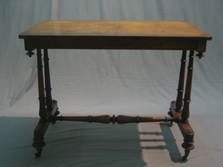 A Victorian rectangular walnut quarter veneered stretcher table raised on turned and block supports with turned stretcher 38"