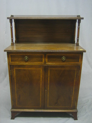 A 20th Century Georgian style inlaid mahogany chiffonier with raised back and pierced brass three-quarter gallery, the base fitted 2 drawers above a double cupboard, raised on bracket feet 28"