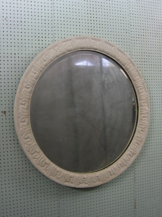 A Victorian circular bevelled plate mirror contained in a white painted carved oak frame 34"