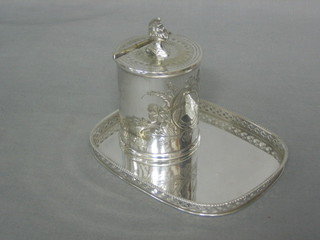 A rectangular silver plated salver with pierced border 6 1/2" together with a cylindrical silver sugar pot (2)