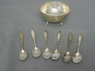 A circular embossed Eastern silver bowl together with 5 silver spoons 4 ozs