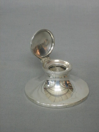 A silver capstan inkwell with hinged lid (marks rubbed) 4"
