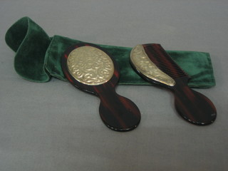 A modern miniature "tortoiseshell" and silver comb together with a matching pocket hand mirror