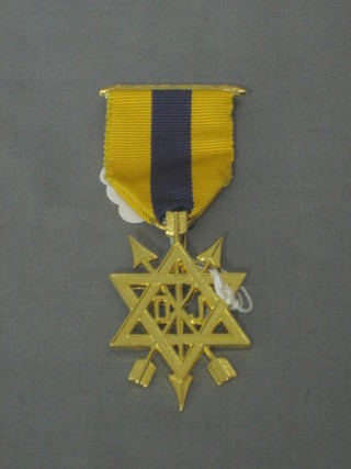 A gilt metal Order of the Sacred Monitor jewel