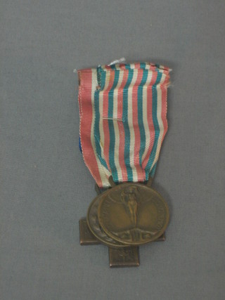 A  Italian WWI War Cross, an Italian medal and a Belgium medal