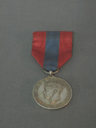 A George VI Imperial Service medal to Rosamund Teresa Dorothy Watts