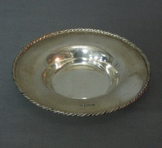 A circular silver dish with rope edge border, Sheffield 1896