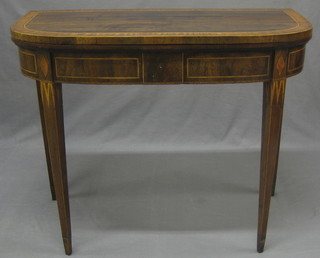 A 19th Century mahogany D shaped card table inlaid satinwood stringing raised on square tapering supports 35"
