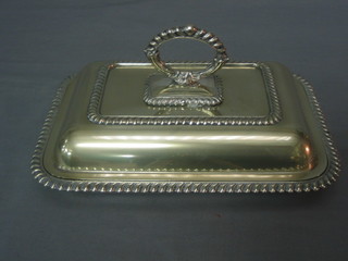 A rectangular silver plated entree dish and cover with gadrooned decoration
