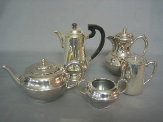 A 3 piece silver plated hotelware tea service comprising teapot, hotwater jug and milk jug together with 2 silver plated hotwater jugs